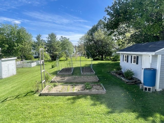 72 Winship St, Bath, ME 04530 - view of yard featuring a vegetable garden, an outdoor structure, and view of wooded area