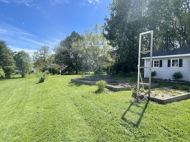 72 Winship St, Bath, ME 04530 - view of green lawn with a vegetable garden and view of wooded area