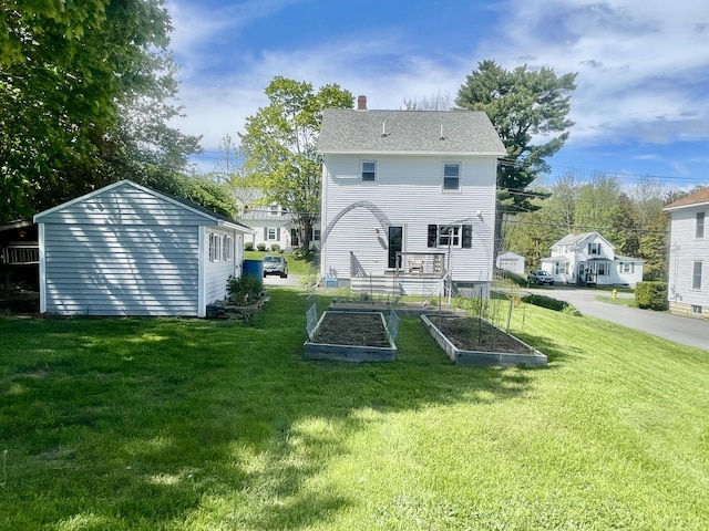 72 Winship St, Bath, ME 04530 - back of property featuring a vegetable garden, a yard, and a chimney
