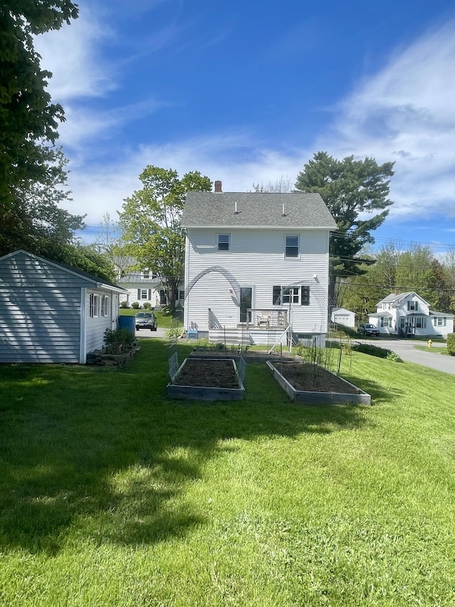 72 Winship St, Bath, ME 04530 - rear view of property with a garden, a yard, and a chimney