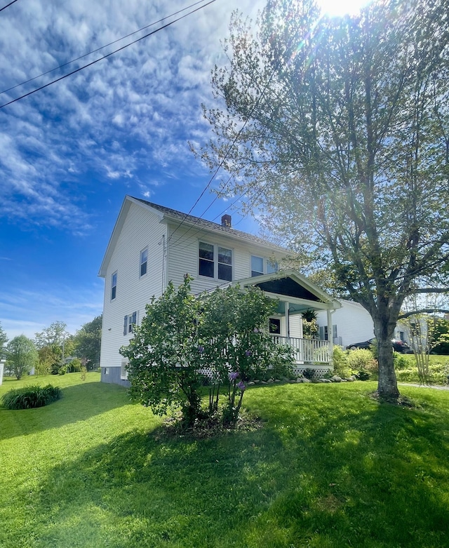 72 Winship St, Bath, ME 04530 - view of side of home featuring a yard, a chimney, and a porch
