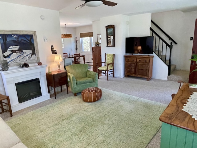 72 Winship St, Bath, ME 04530 - carpeted living area featuring ceiling fan, stairway, and a glass covered fireplace