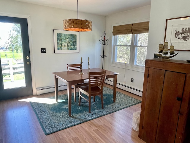 72 Winship St, Bath, ME 04530 - dining area featuring baseboard heating, plenty of natural light, and wood finished floors