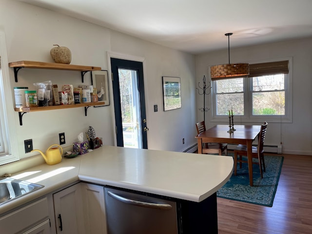 72 Winship St, Bath, ME 04530 - kitchen featuring dishwasher, a peninsula, wood finished floors, and plenty of natural light