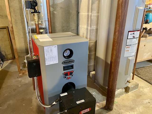 72 Winship St, Bath, ME 04530 - utility room featuring electric water heater and a heating unit