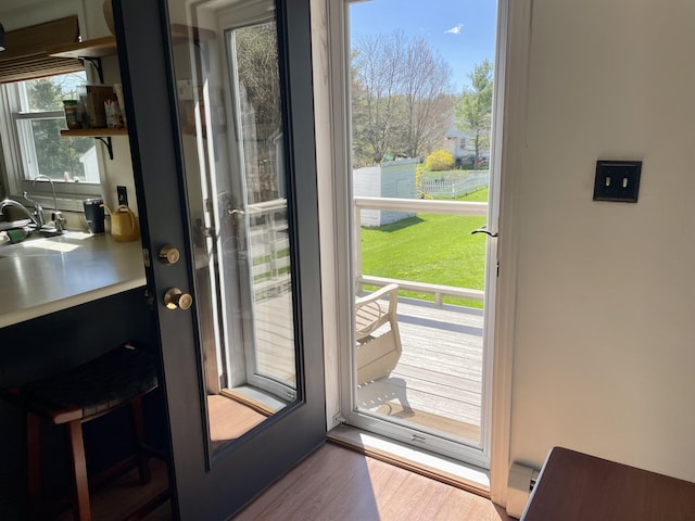 72 Winship St, Bath, ME 04530 - doorway with wood finished floors and a sink