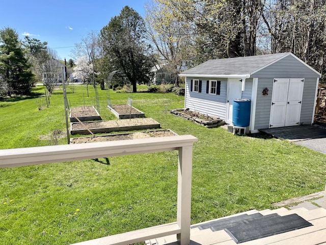 72 Winship St, Bath, ME 04530 - view of grassy yard with a vegetable garden and an outdoor structure