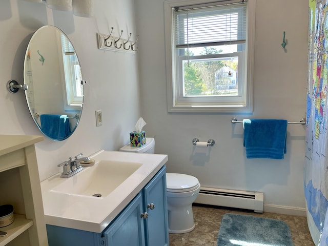 72 Winship St, Bath, ME 04530 - bathroom with a baseboard heating unit, healthy amount of natural light, vanity, and toilet