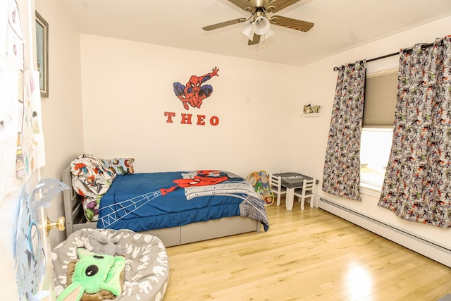 9 Camden Ct Unit 9, Bangor, ME 04401 - bedroom featuring a baseboard radiator, wood finished floors, and ceiling fan