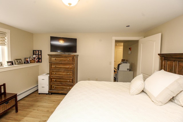 9 Camden Ct Unit 9, Bangor, ME 04401 - bedroom with a baseboard radiator and light wood-style flooring
