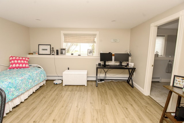 9 Camden Ct Unit 9, Bangor, ME 04401 - bedroom with baseboard heating, wood finished floors, a baseboard heating unit, and baseboards