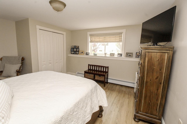 9 Camden Ct Unit 9, Bangor, ME 04401 - bedroom with a baseboard heating unit, light wood-style floors, a closet, and baseboards