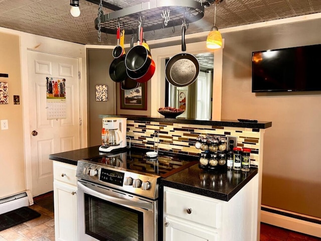 90 N Ave, Skowhegan, ME 04976 - kitchen featuring an ornate ceiling, electric range, baseboard heating, white cabinetry, and dark countertops