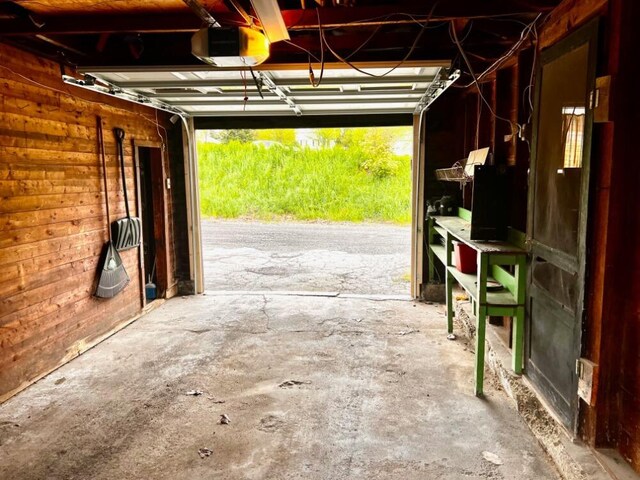 90 N Ave, Skowhegan, ME 04976 - garage featuring a garage door opener