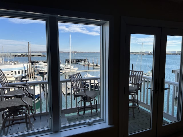311 Chandlers Wharf Unit 311, Portland, ME 04101 - doorway to outside with a water view and healthy amount of natural light