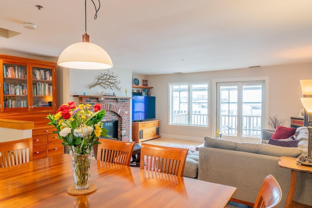 311 Chandlers Wharf Unit 311, Portland, ME 04101 - dining room featuring a fireplace and baseboards