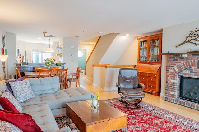 311 Chandlers Wharf Unit 311, Portland, ME 04101 - living room featuring a fireplace and light wood-style floors