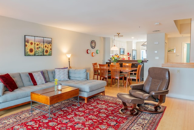 311 Chandlers Wharf Unit 311, Portland, ME 04101 - living room featuring light wood-style floors