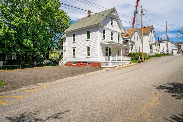 31 Bath St, Bath, ME 04530 - view of front of house with covered porch and a chimney