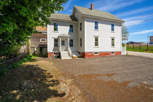 31 Bath St, Bath, ME 04530 - back of property with a chimney and a shingled roof