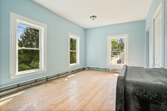 31 Bath St, Bath, ME 04530 - unfurnished bedroom featuring wood finished floors and a baseboard radiator