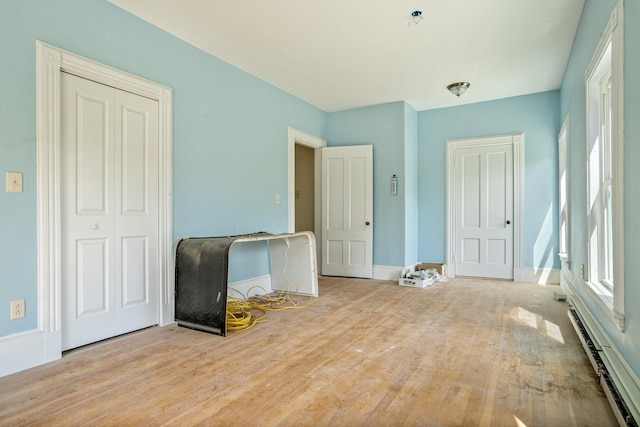 31 Bath St, Bath, ME 04530 - spare room featuring wood finished floors, baseboard heating, and baseboards