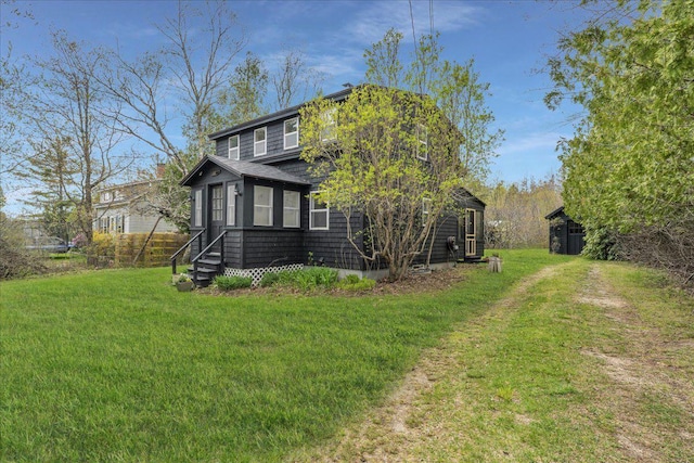 637 Falls Bridge Rd, Blue Hill, ME 04614 - view of home's exterior with a lawn