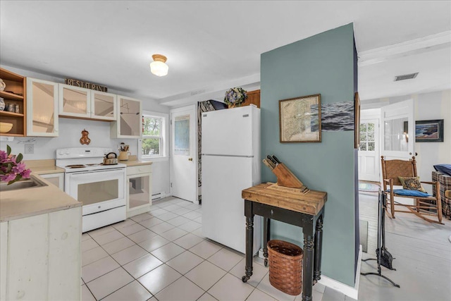 637 Falls Bridge Rd, Blue Hill, ME 04614 - kitchen with white appliances, open shelves, light countertops, baseboard heating, and light tile patterned flooring