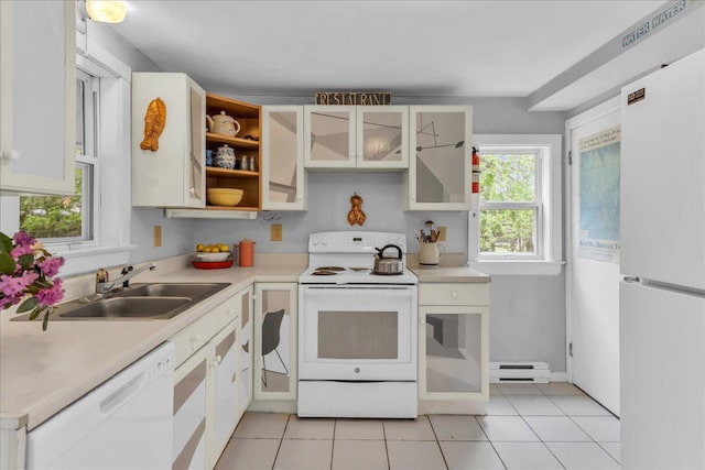 637 Falls Bridge Rd, Blue Hill, ME 04614 - kitchen with white appliances, a sink, light countertops, light tile patterned flooring, and baseboard heating