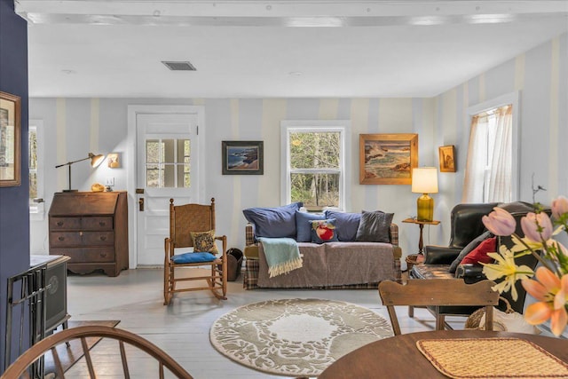 637 Falls Bridge Rd, Blue Hill, ME 04614 - living area featuring wallpapered walls and light wood-style floors