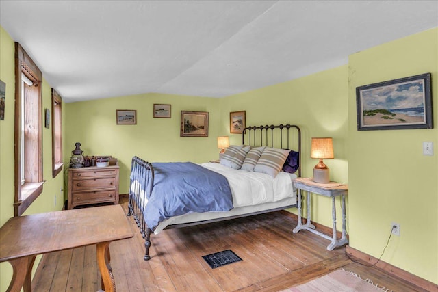 637 Falls Bridge Rd, Blue Hill, ME 04614 - bedroom featuring wood-type flooring, baseboards, and lofted ceiling
