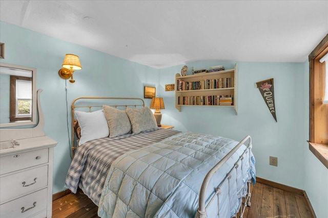637 Falls Bridge Rd, Blue Hill, ME 04614 - bedroom featuring dark wood-style flooring, baseboards, and vaulted ceiling
