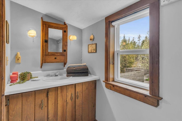 637 Falls Bridge Rd, Blue Hill, ME 04614 - bathroom featuring lofted ceiling and vanity