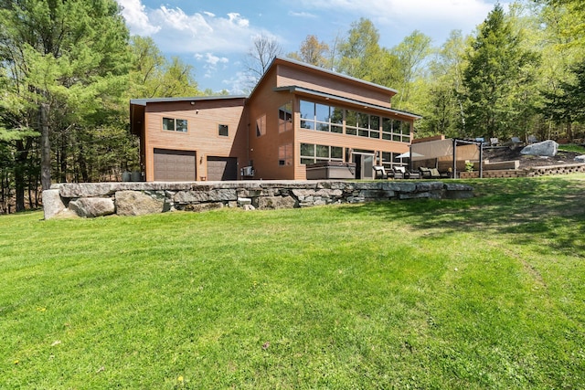 36 Sunset Dr, Saint Albans, ME 04971 - rear view of house featuring an attached garage and a lawn