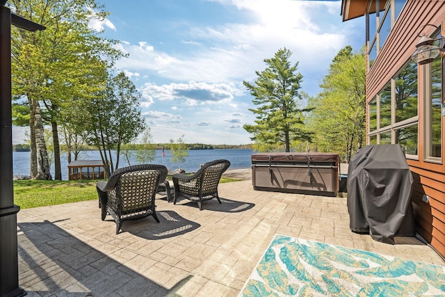36 Sunset Dr, Saint Albans, ME 04971 - view of patio with a hot tub and a water view