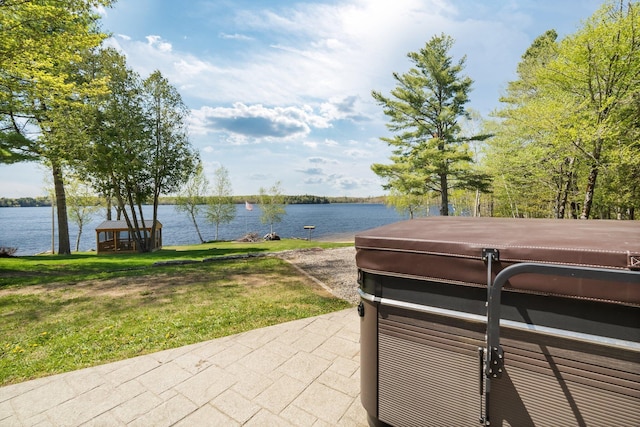 36 Sunset Dr, Saint Albans, ME 04971 - view of patio / terrace with a hot tub and a water view