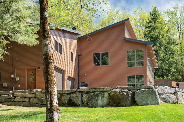 36 Sunset Dr, Saint Albans, ME 04971 - view of property exterior with an attached garage and a yard