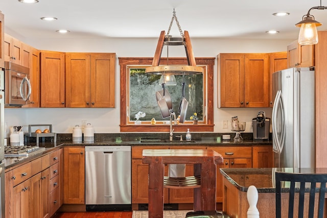 36 Sunset Dr, Saint Albans, ME 04971 - kitchen with stainless steel appliances, a sink, recessed lighting, dark stone countertops, and brown cabinets