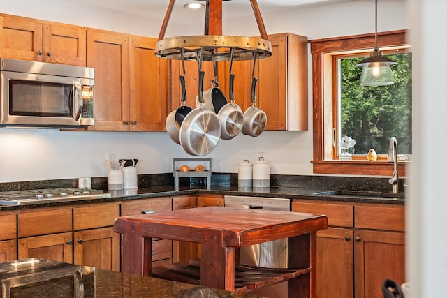 36 Sunset Dr, Saint Albans, ME 04971 - kitchen with appliances with stainless steel finishes, a sink, brown cabinets, and hanging light fixtures