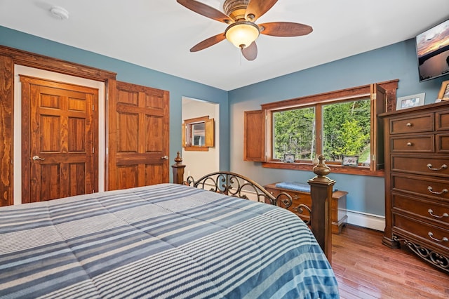36 Sunset Dr, Saint Albans, ME 04971 - bedroom with light wood finished floors, a baseboard heating unit, and a ceiling fan