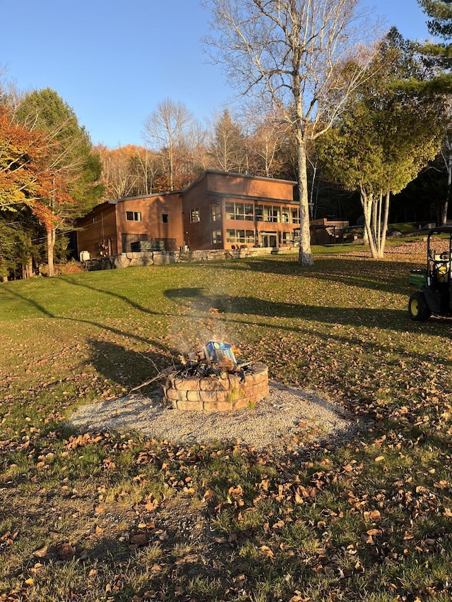 36 Sunset Dr, Saint Albans, ME 04971 - view of grassy yard with a fire pit
