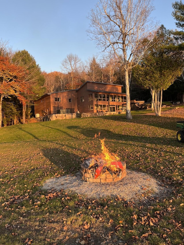 36 Sunset Dr, Saint Albans, ME 04971 - back of property featuring a fire pit and a yard