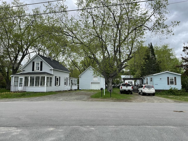51 Parlin St, Skowhegan, ME 04976 - view of front of house with an outdoor structure and driveway