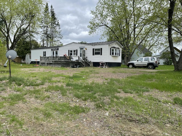 51 Parlin St, Skowhegan, ME 04976 - view of front facade featuring a wooden deck