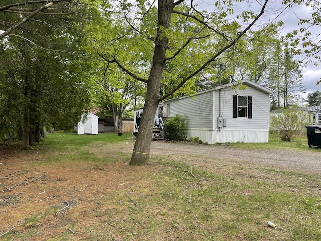 51 Parlin St, Skowhegan, ME 04976 - view of yard featuring an outbuilding and driveway