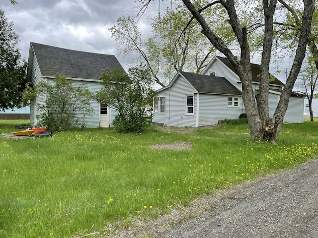 51 Parlin St, Skowhegan, ME 04976 - view of side of property with a shingled roof