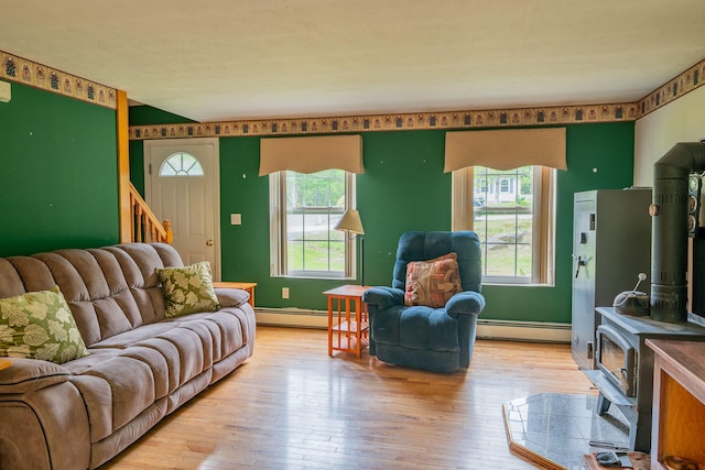 17 Easy St, Standish, ME 04084 - living room with a wood stove, a baseboard radiator, and light wood-style floors