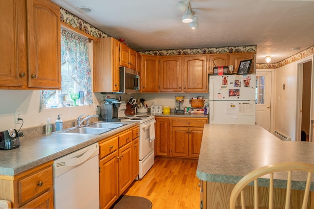 17 Easy St, Standish, ME 04084 - kitchen with white appliances, a sink, a baseboard radiator, light wood-style flooring, and brown cabinetry