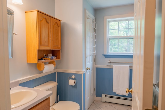 17 Easy St, Standish, ME 04084 - full bath featuring baseboard heating, vanity, toilet, wainscoting, and tile patterned floors
