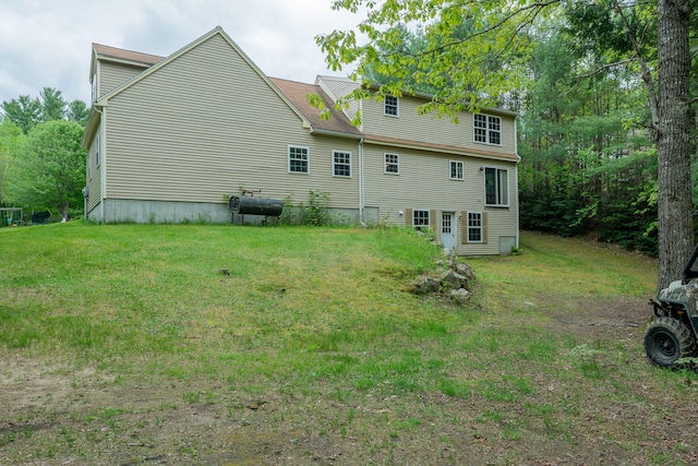 17 Easy St, Standish, ME 04084 - back of house featuring a lawn and oil tank